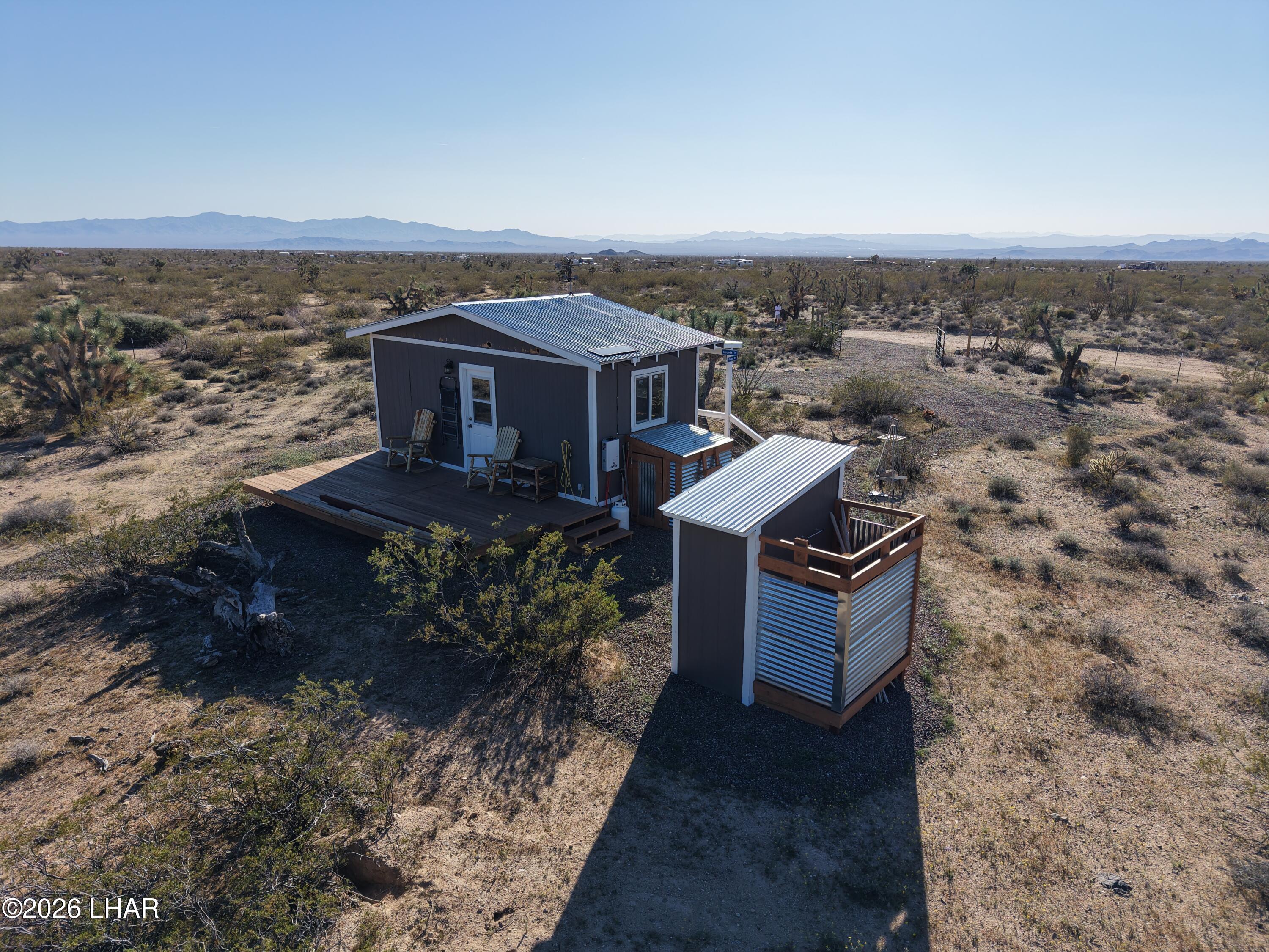 127 South Carrow Road Yucca, AZ 86438 - Photo 14 of 39 a view of a terrace with a garden