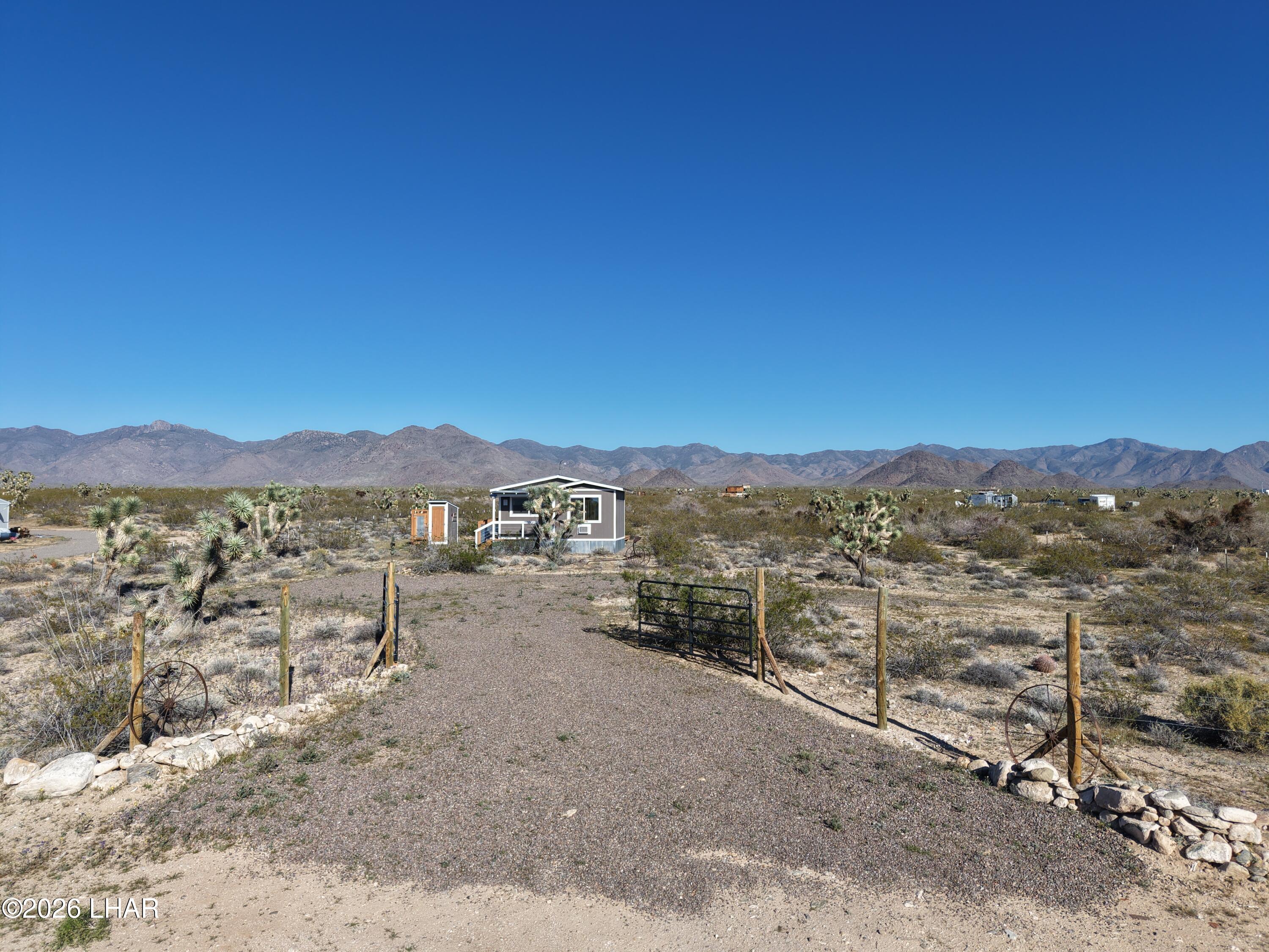 127 South Carrow Road Yucca, AZ 86438 - Photo 35 of 39 a view of a lake with a mountain