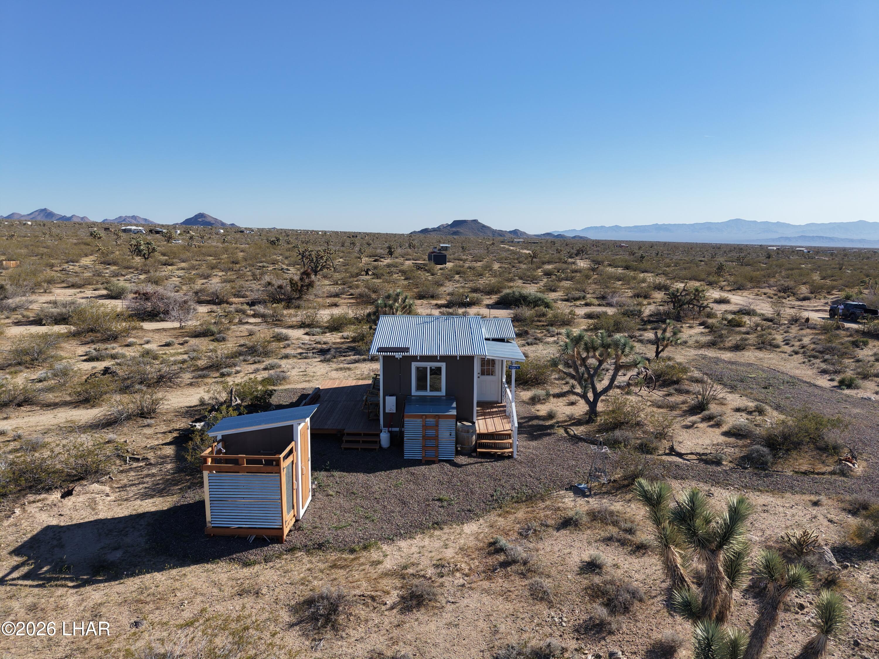 127 South Carrow Road Yucca, AZ 86438 - Photo 8 of 39 an aerial view of a house with a yard