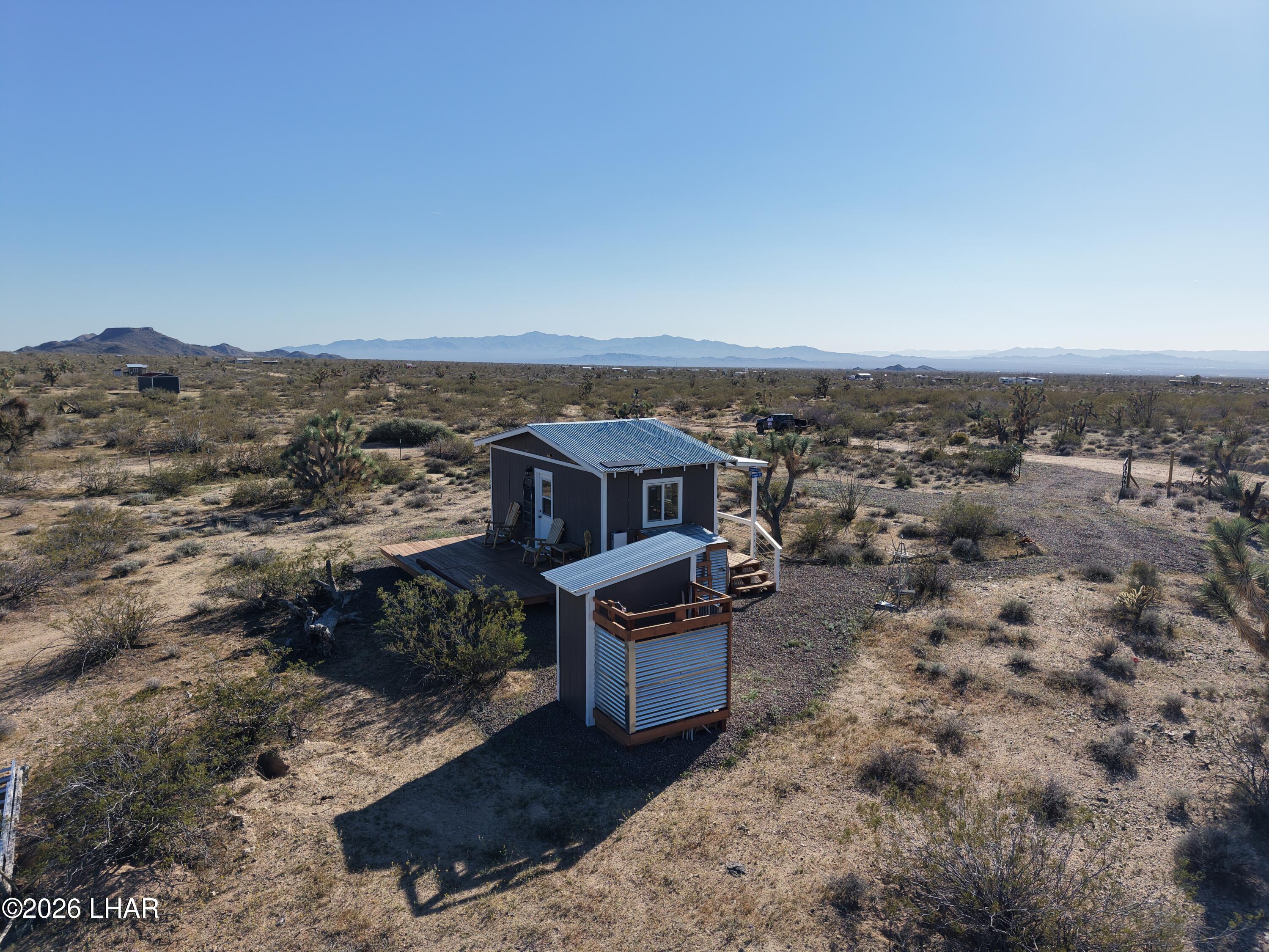 127 South Carrow Road Yucca, AZ 86438 - Photo 9 of 39 an aerial view of a house with a yard