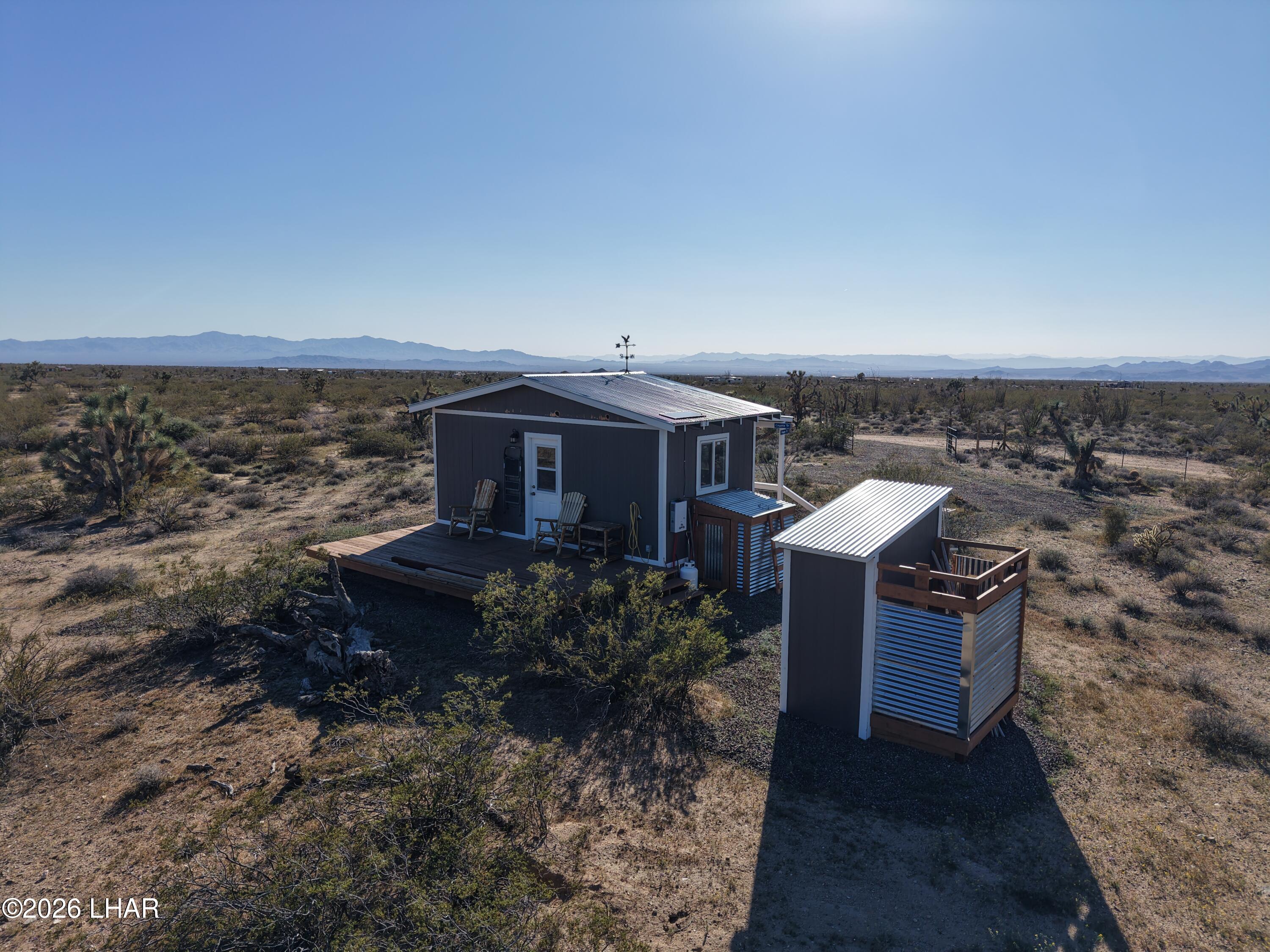 127 South Carrow Road Yucca, AZ 86438 - Photo 10 of 39 an aerial view of a house with a yard