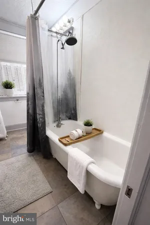a bathroom with a sink and a bath tub