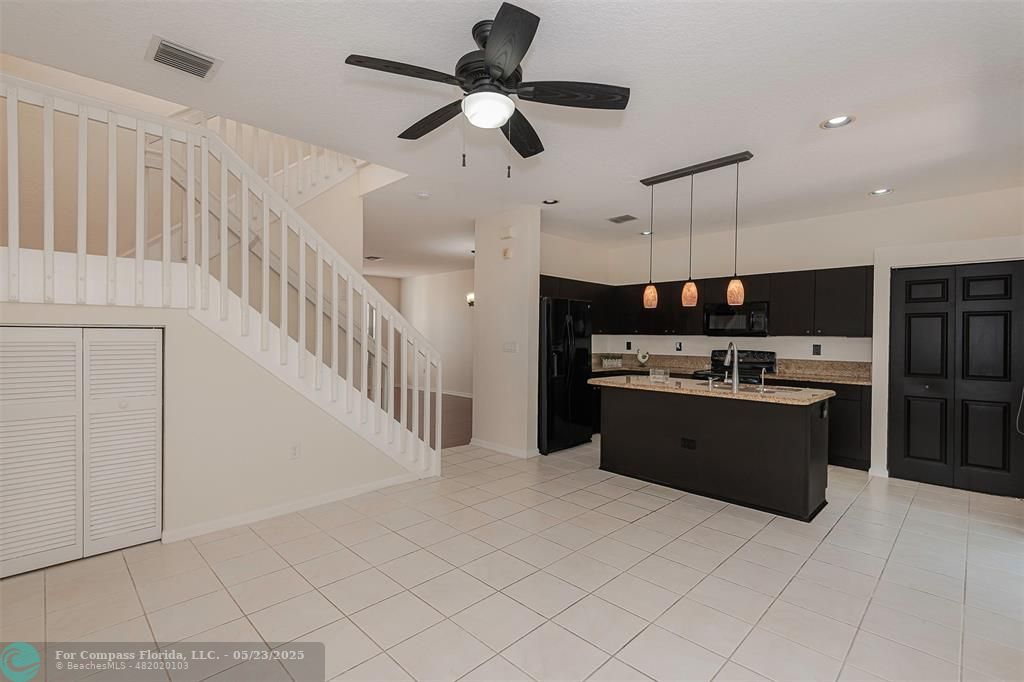18798 Southwest 28th Street, Unit 18798 Miramar, FL 33029 - Photo 13 of 28 a large kitchen with a large counter top appliances and cabinets