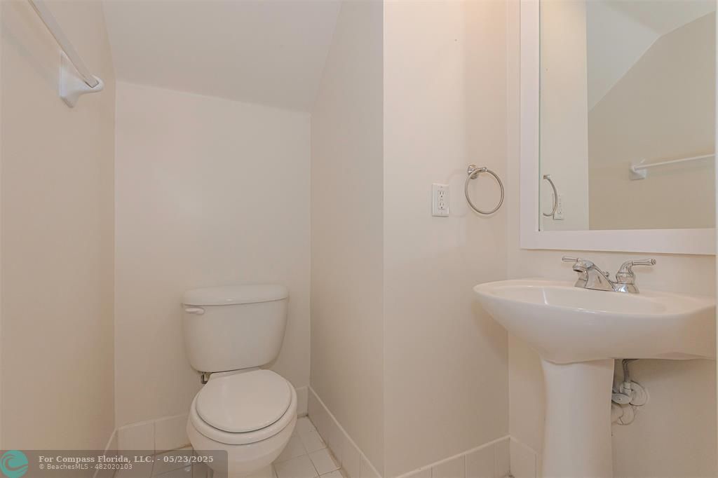 18798 Southwest 28th Street, Unit 18798 Miramar, FL 33029 - Photo 14 of 28 a white toilet sitting next to a bathroom sink