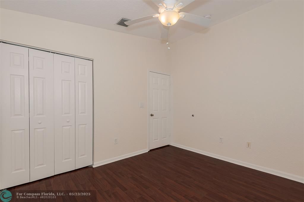 18798 Southwest 28th Street, Unit 18798 Miramar, FL 33029 - Photo 20 of 28 a view of an empty room with wooden floor