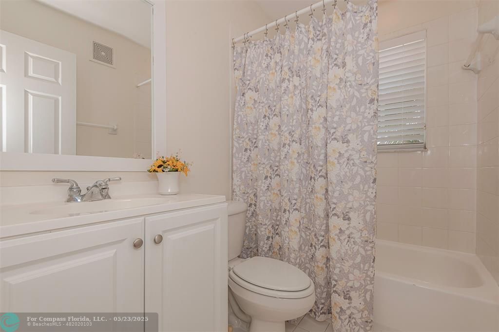18798 Southwest 28th Street, Unit 18798 Miramar, FL 33029 - Photo 21 of 28 a bathroom with a sink a toilet and a tub