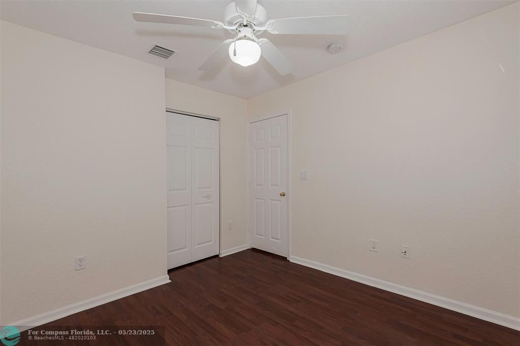 18798 Southwest 28th Street, Unit 18798 Miramar, FL 33029 - Photo 23 of 28 a view of an empty room with wooden floor