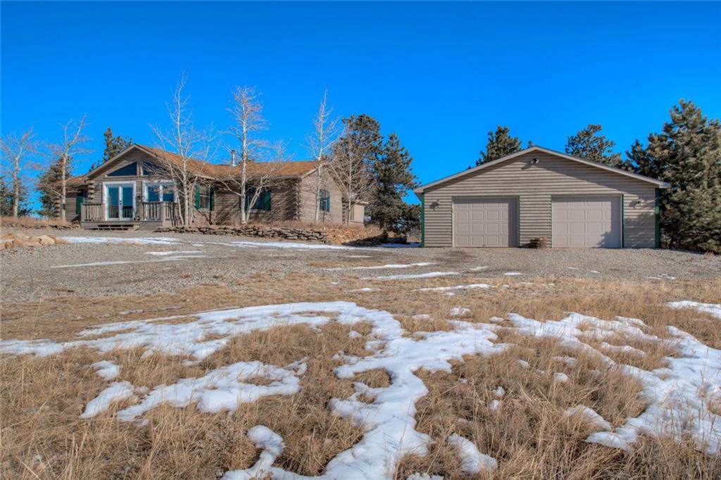 468 Wagon Wheel Road Hartsel, CO 80449 - Photo 1 of 30 a front view of a house with a yard