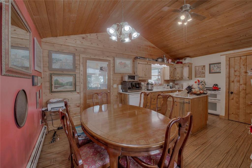 468 Wagon Wheel Road Hartsel, CO 80449 - Photo 12 of 30 a view of a dining room with furniture and wooden floor