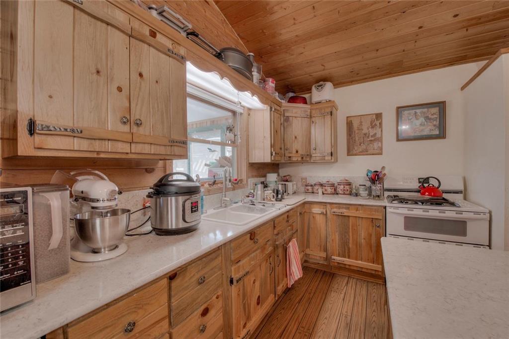 468 Wagon Wheel Road Hartsel, CO 80449 - Photo 15 of 30 a kitchen with sink cabinets and window
