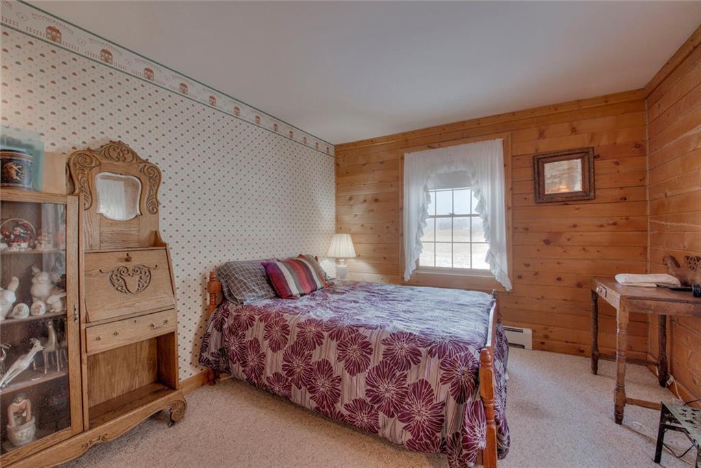 468 Wagon Wheel Road Hartsel, CO 80449 - Photo 20 of 30 a bedroom with a bed and a table in it