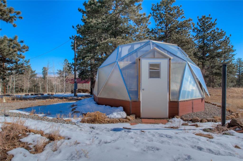 468 Wagon Wheel Road Hartsel, CO 80449 - Photo 4 of 30 a backyard of a house with wooden fence