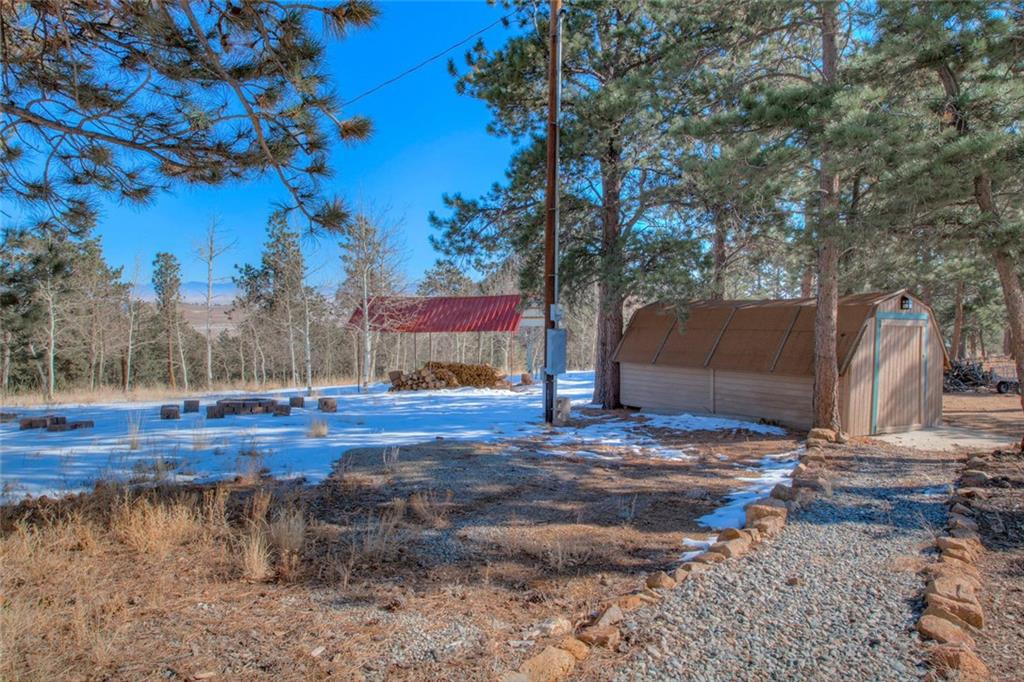 468 Wagon Wheel Road Hartsel, CO 80449 - Photo 5 of 30 a view of a yard with wooden fence