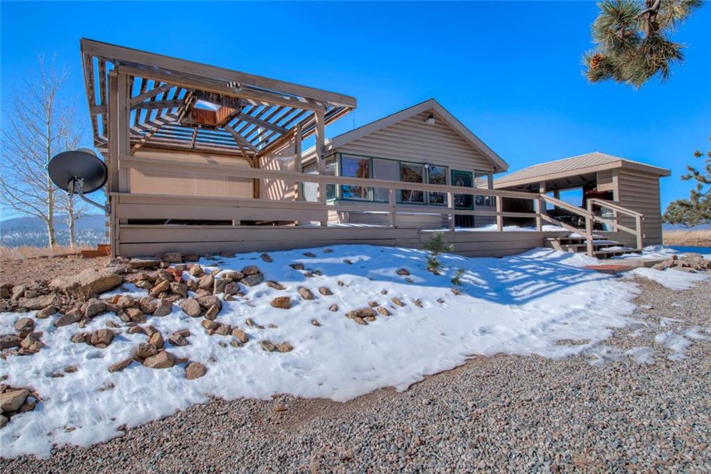 468 Wagon Wheel Road Hartsel, CO 80449 - Photo 6 of 30 a front view of a house with garden