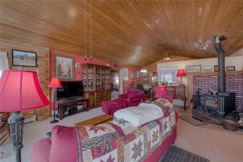 468 Wagon Wheel Road Hartsel, CO 80449 - Photo 8 of 30 a bed room with a bed furniture and a flat screen tv