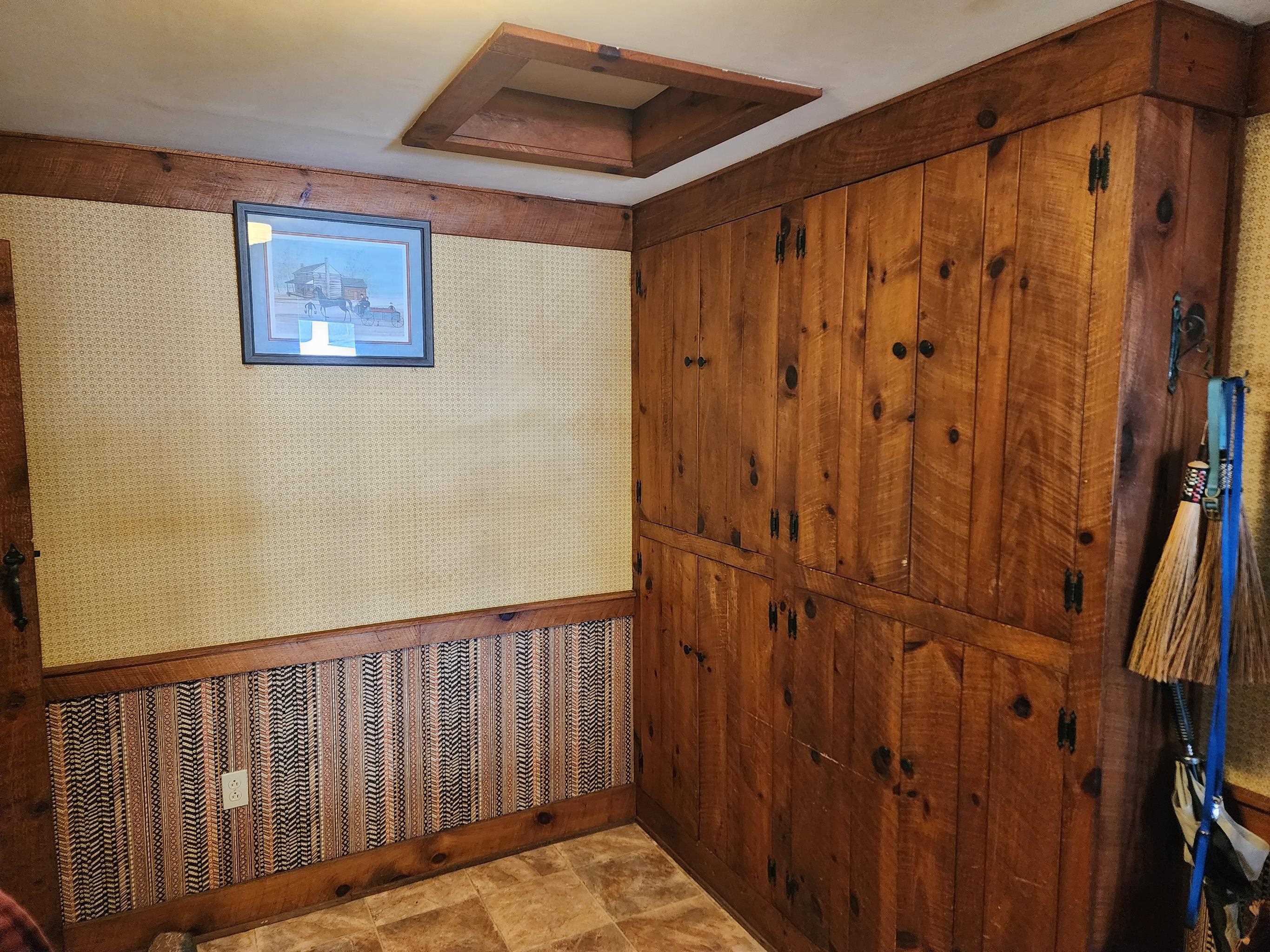 11611 Cowpasture River Road Williamsville, VA 24487 - Photo 13 of 29 a view of a hallway with wooden walls