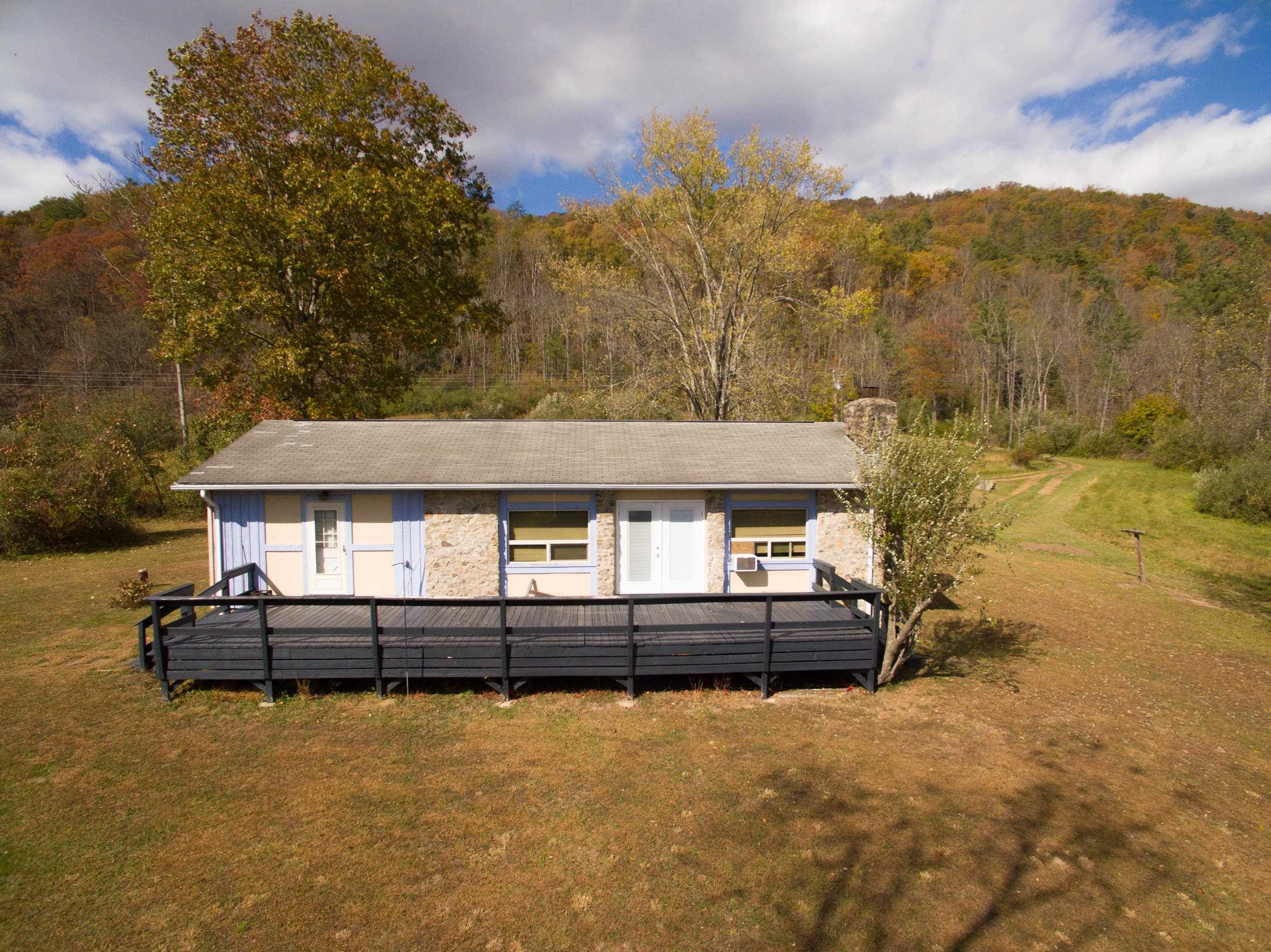 11611 Cowpasture River Road Williamsville, VA 24487 - Photo 29 of 29 front view of a house with a yard