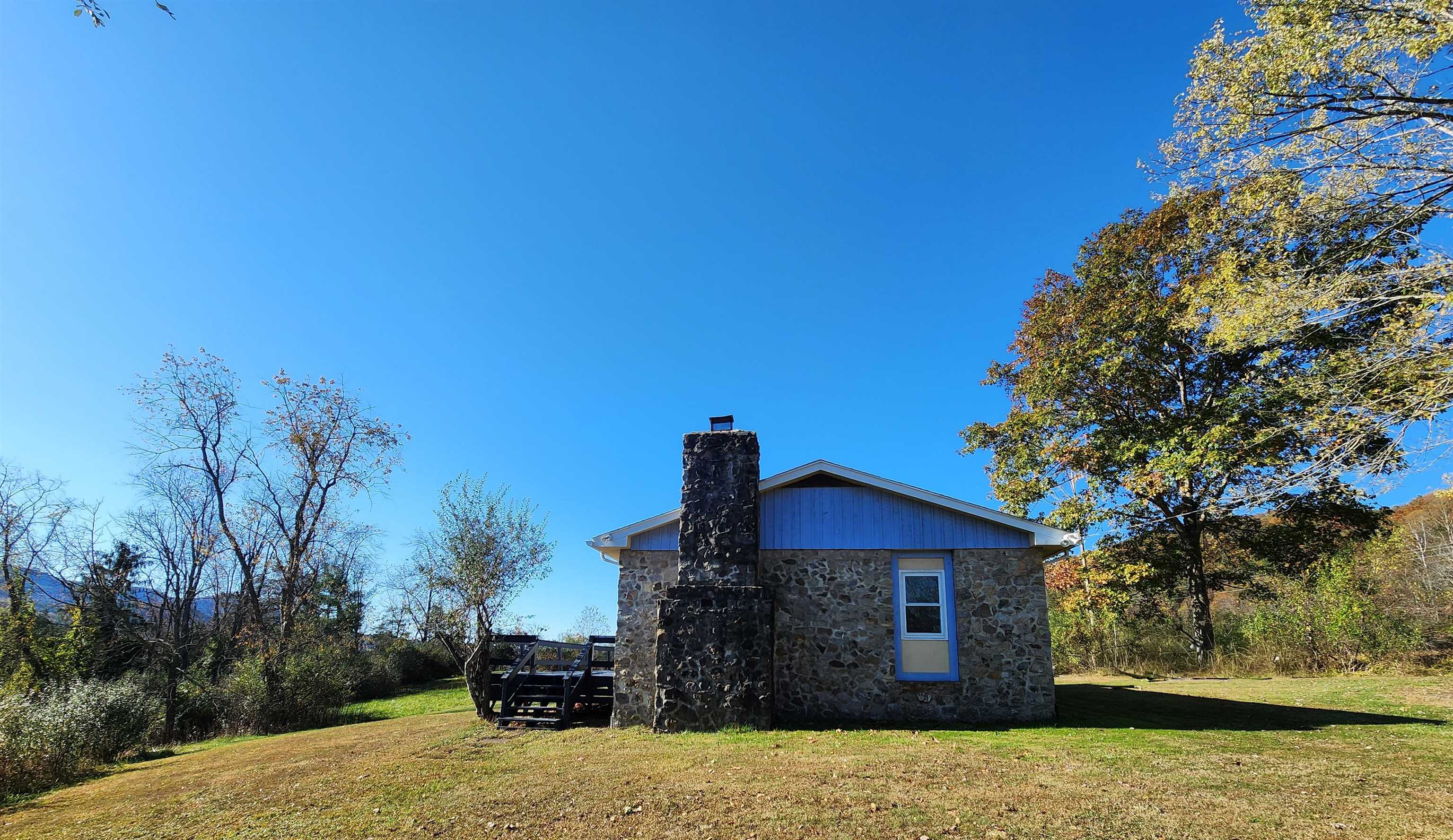 11611 Cowpasture River Road Williamsville, VA 24487 - Photo 9 of 29 a front view of a house with a yard