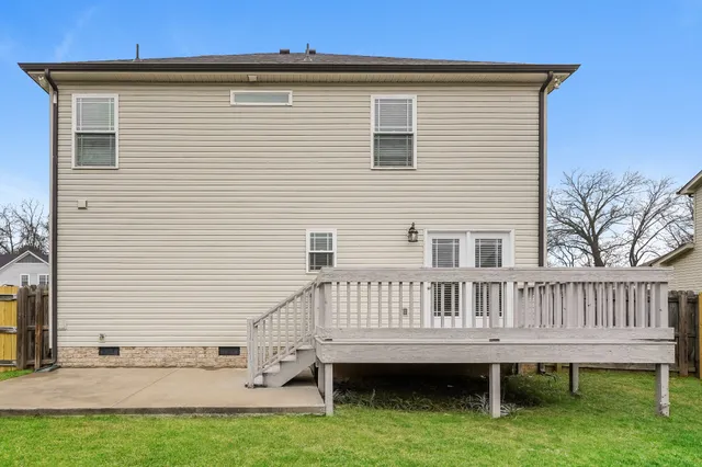 a view of backyard with deck