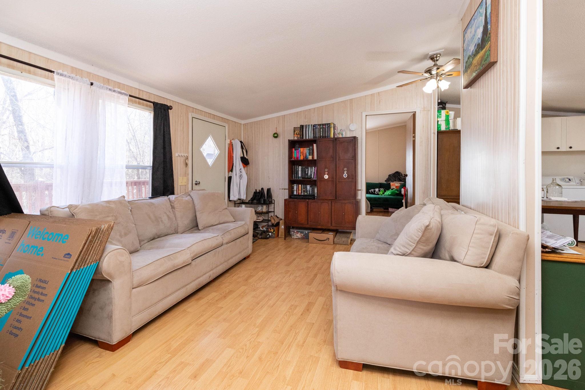 143 Hubert McCall Drive Balsam Grove, NC 28708 - Photo 4 of 21 a living room with furniture and a large window