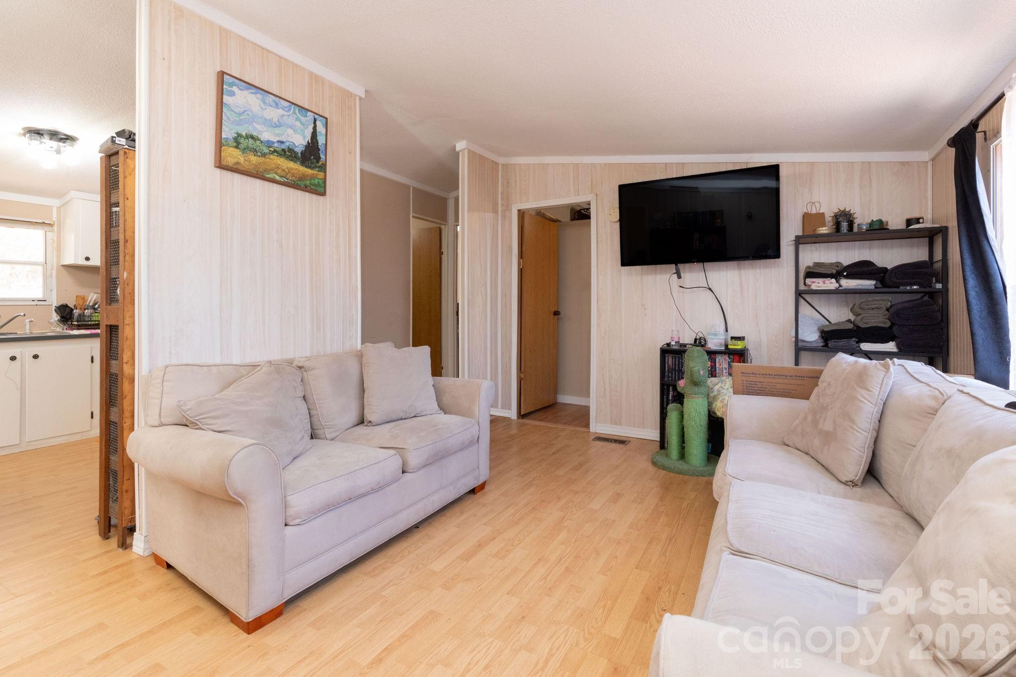 143 Hubert McCall Drive Balsam Grove, NC 28708 - Photo 5 of 21 a living room with furniture and a flat screen tv