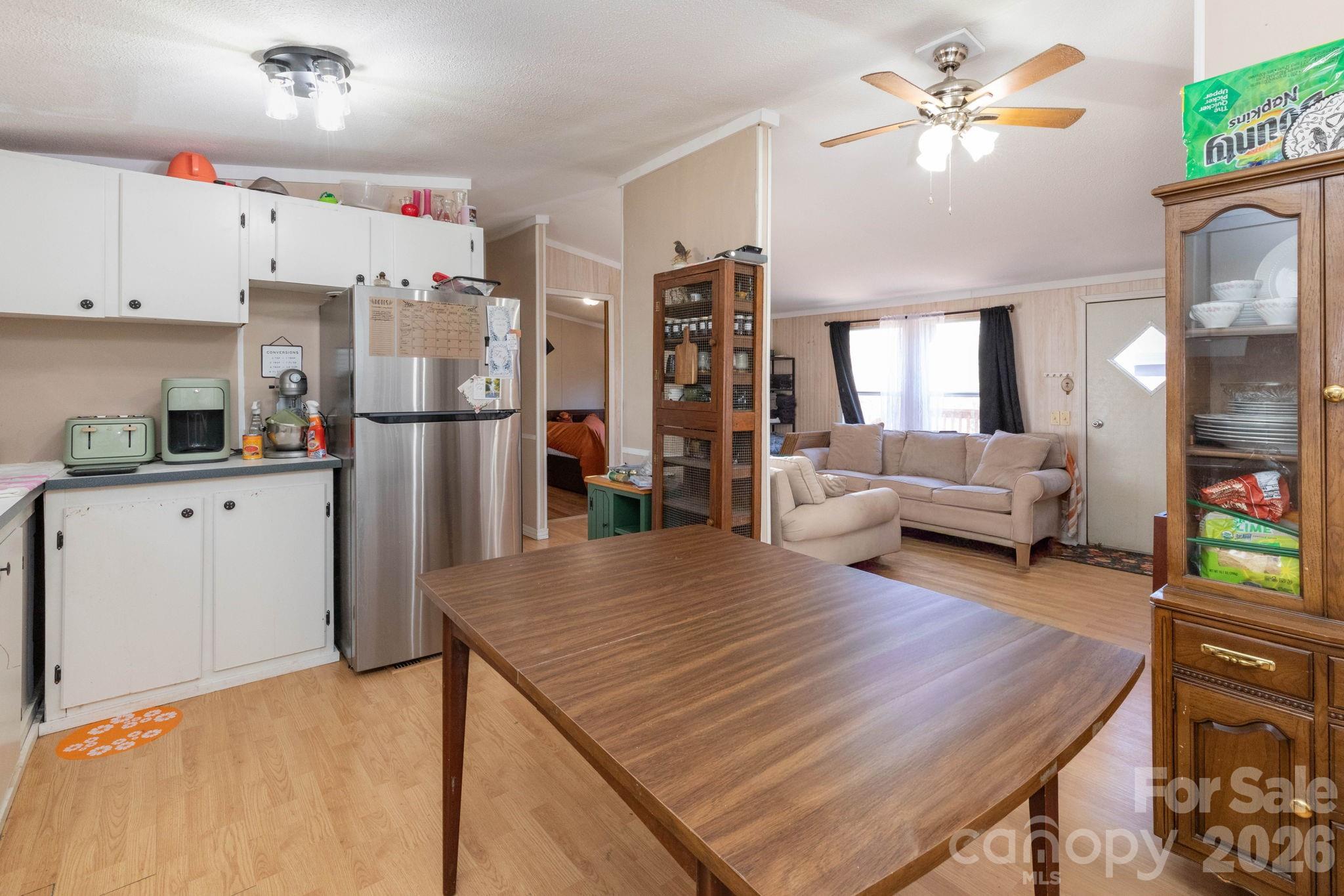 143 Hubert McCall Drive Balsam Grove, NC 28708 - Photo 7 of 21 a kitchen with refrigerator and cabinets
