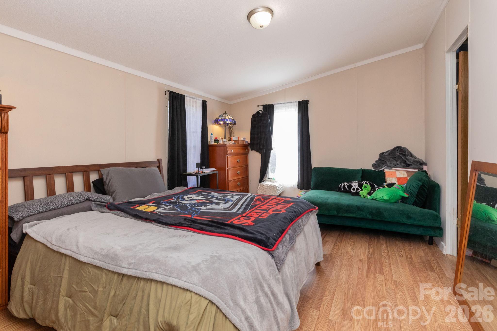 143 Hubert McCall Drive Balsam Grove, NC 28708 - Photo 9 of 21 a bedroom with a bed and a dresser in it
