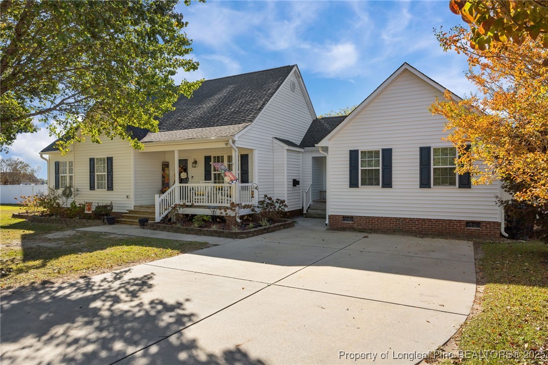 262 River Birch Run Coats, NC 27521 - Photo 2 of 49 a view of a house with swimming pool and sitting area