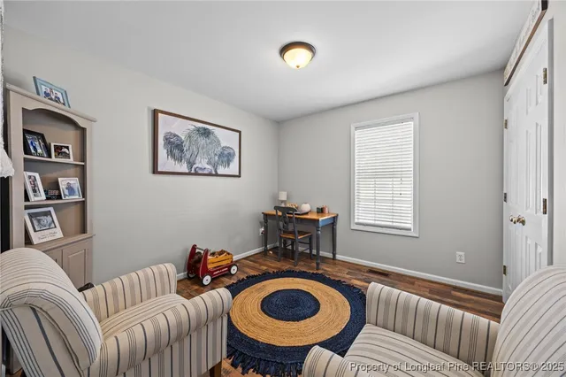 a bathroom with a sink mirror and toilet