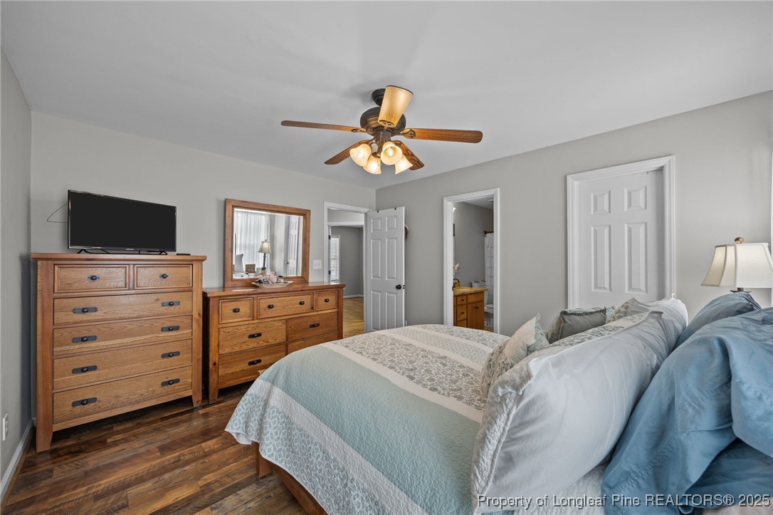 262 River Birch Run Coats, NC 27521 - Photo 37 of 49 a bedroom with a bed and a flat screen tv