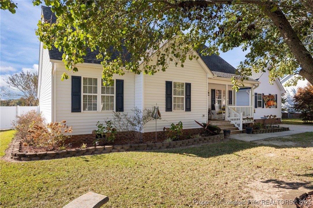 262 River Birch Run Coats, NC 27521 - Photo 4 of 49 a front view of a house with garden