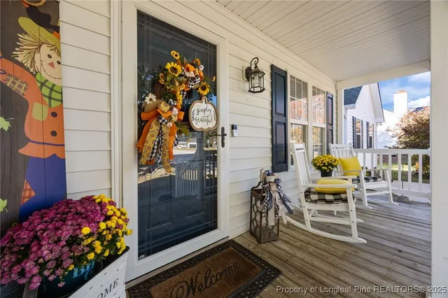 a view of a balcony with wooden floor