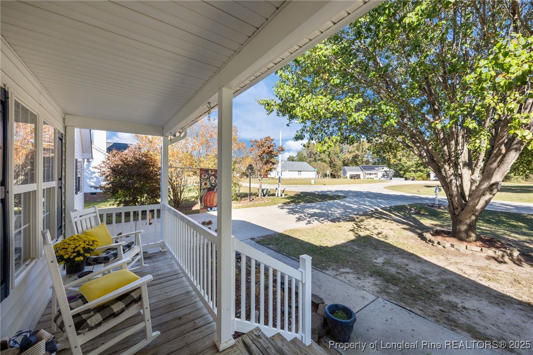 262 River Birch Run Coats, NC 27521 - Photo 48 of 49 a view of a balcony with wooden floor