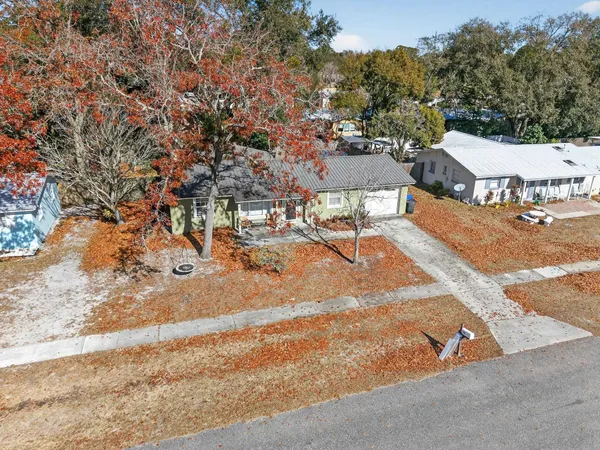 an aerial view of a house with a yard