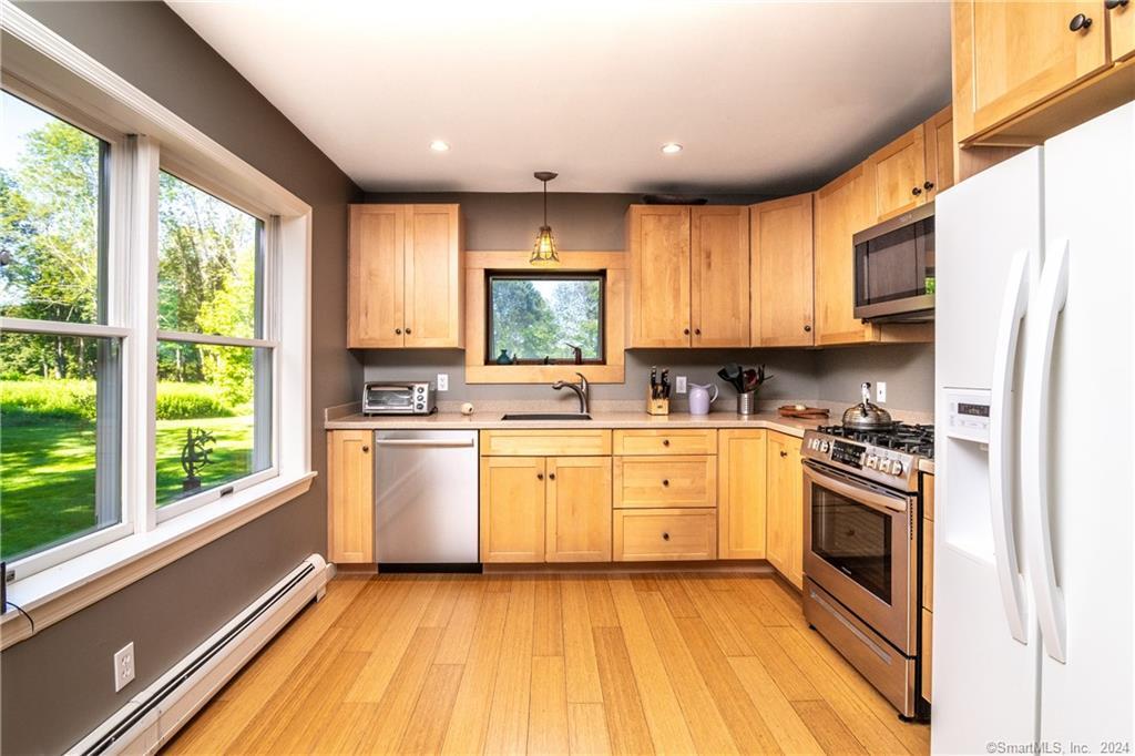 35 Jennings Road Kent, CT 06785 - Photo 1 of 20 a kitchen with a sink window stainless steel appliances and cabinets