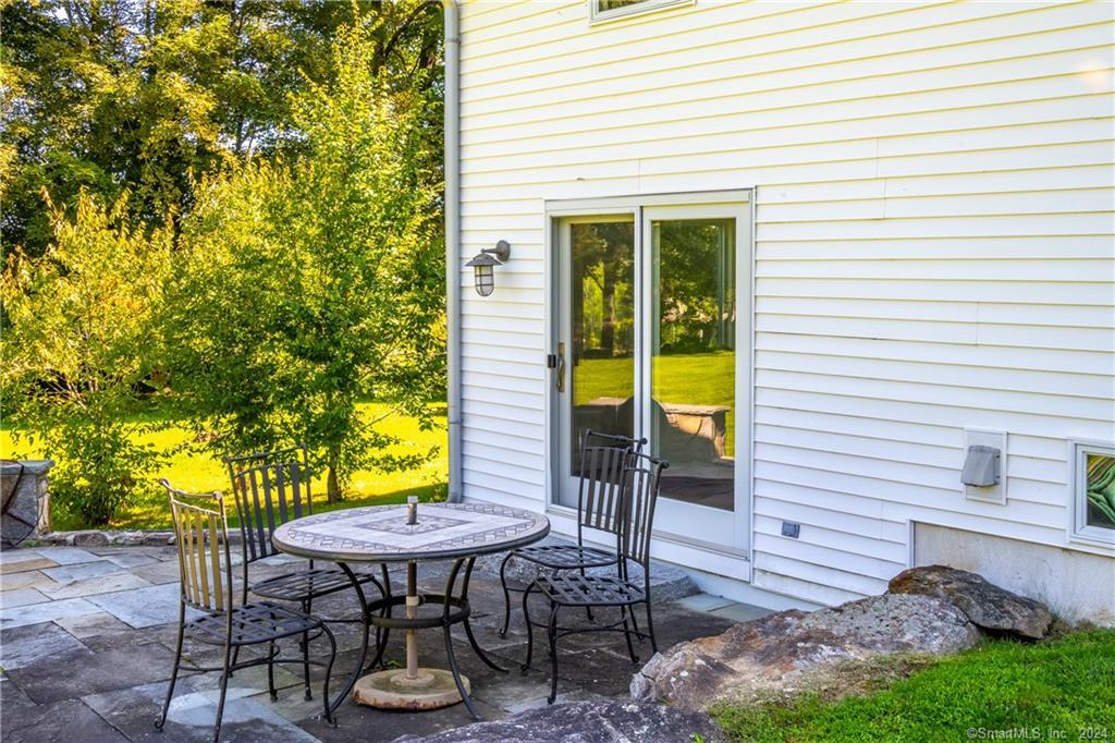 35 Jennings Road Kent, CT 06785 - Photo 17 of 20 a view of a chair and table in backyard of the house