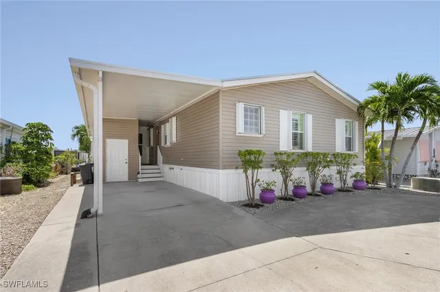 a front view of a house with a garage