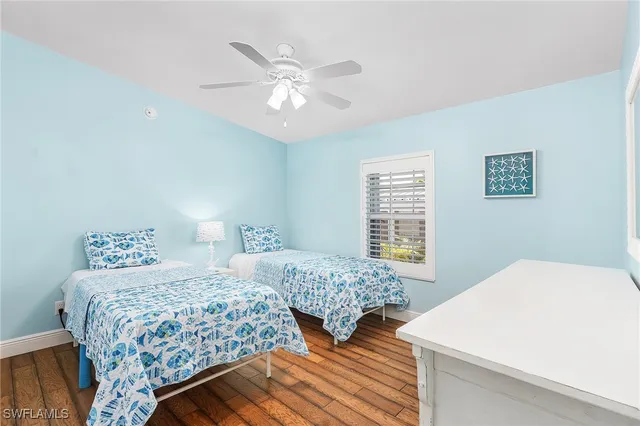 a bedroom with double bed and a window