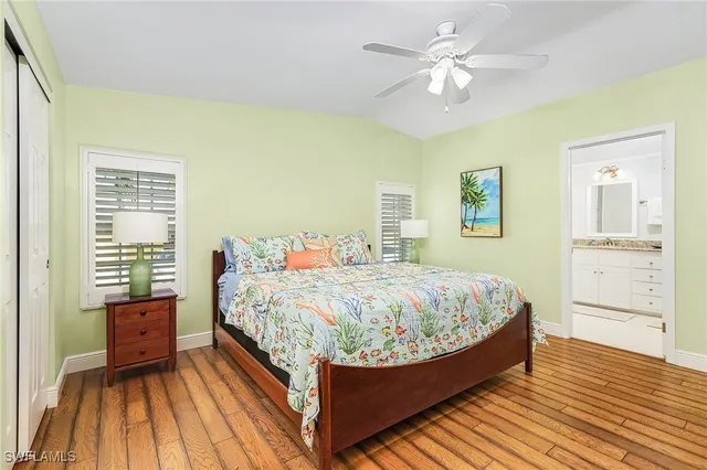 a bed room with a bed and a chandelier