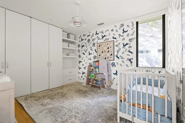 a view of a backyard with a small cabin and a chair