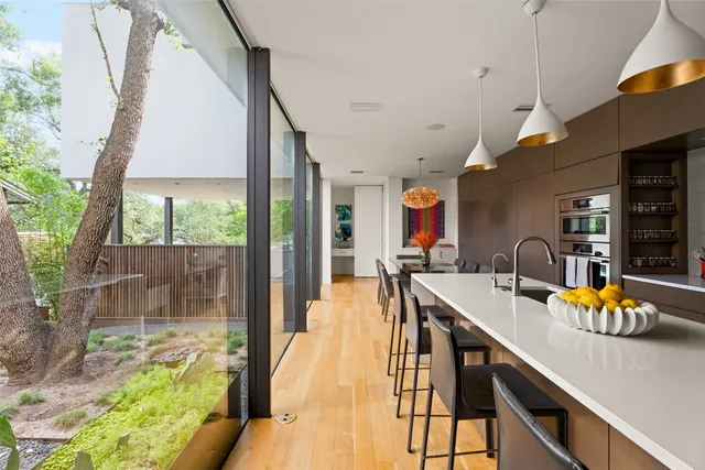 a very nice looking dining room with a large window