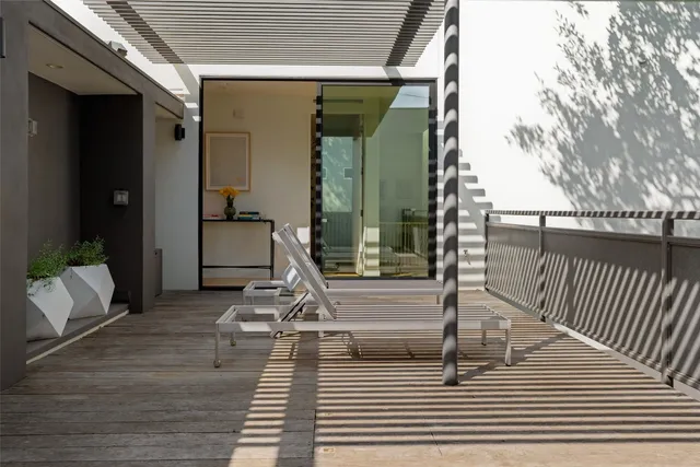 a view of a couches in the balcony