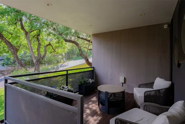 a view of a floor to ceiling window next to a yard