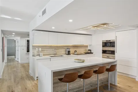 a bedroom with a large bed and a couch