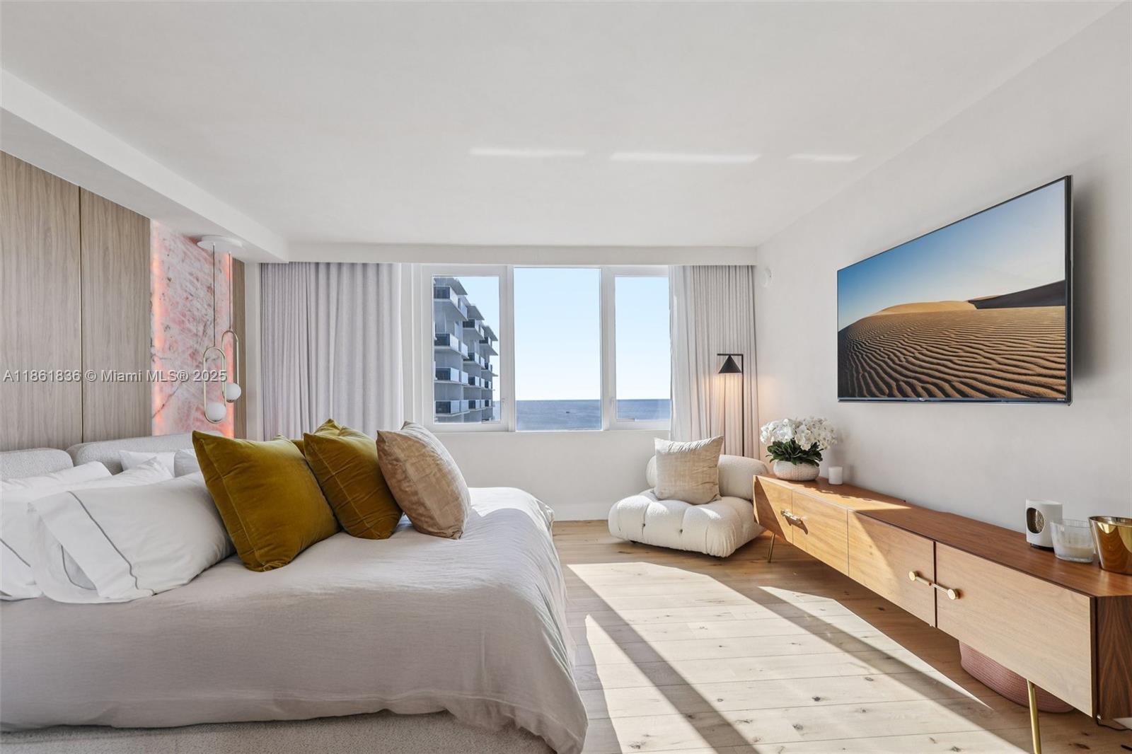 102 24th Street, Unit 1440 Miami Beach, FL 33139 - Photo 20 of 78 a bedroom with a large bed and a couch