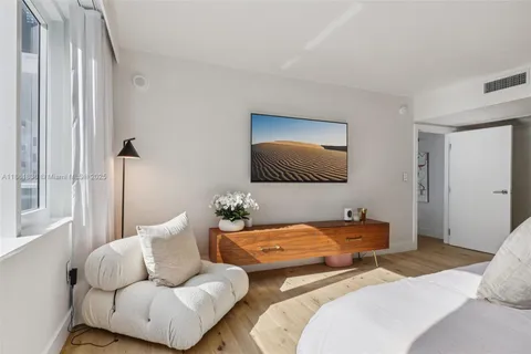 a bedroom with a bed and couch