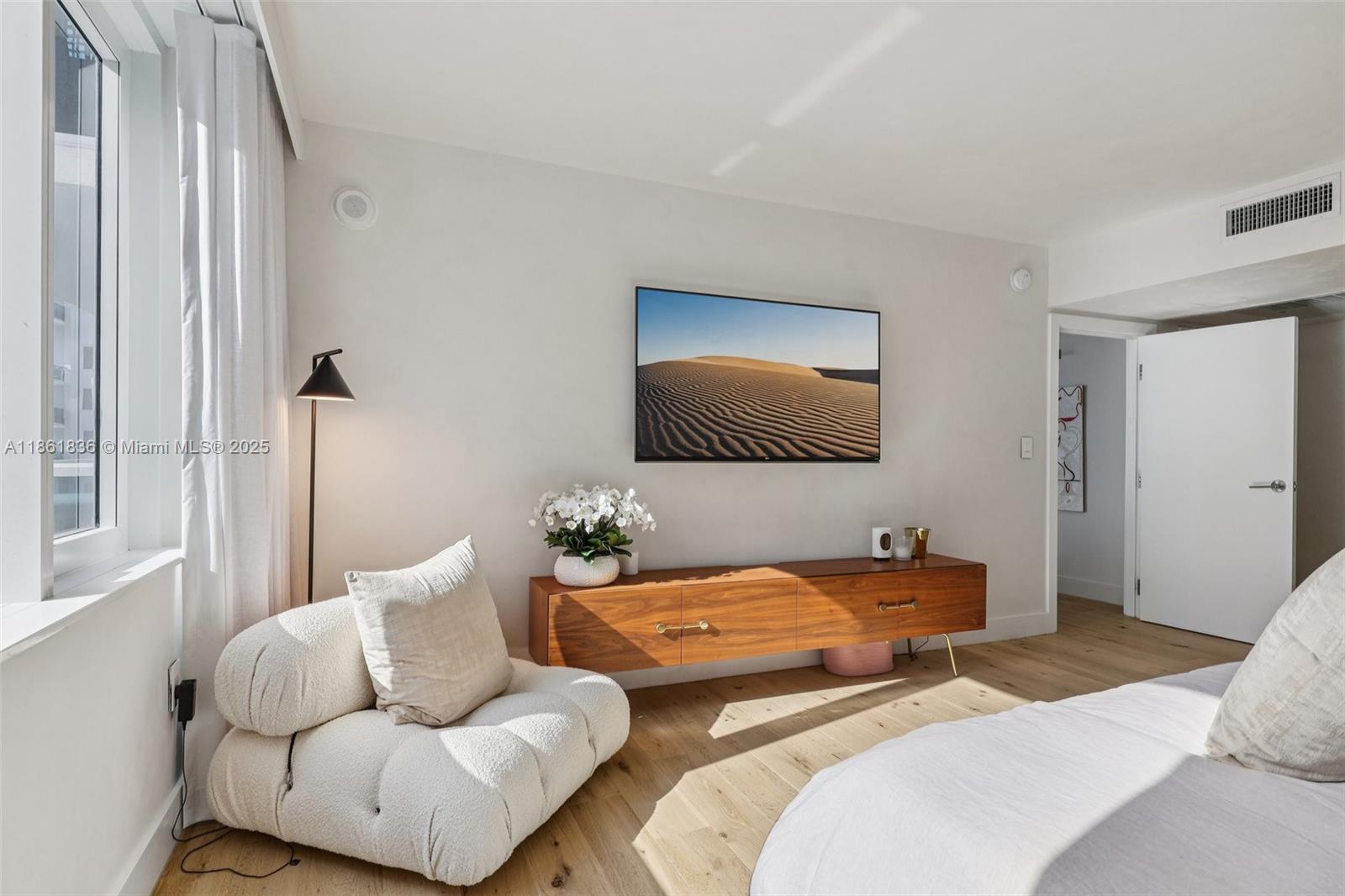 102 24th Street, Unit 1440 Miami Beach, FL 33139 - Photo 22 of 78 a bedroom with two beds and a couch