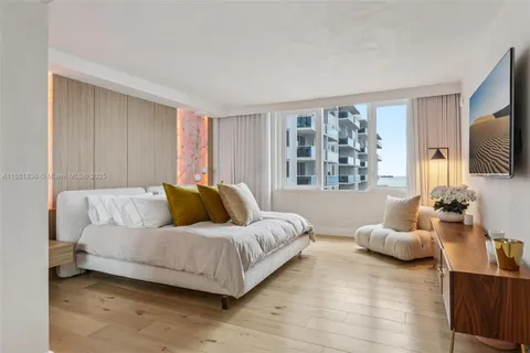 a bedroom with two beds and a couch