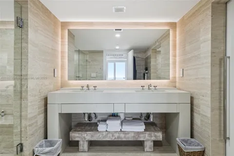 a bedroom with a bed and a lamp on table