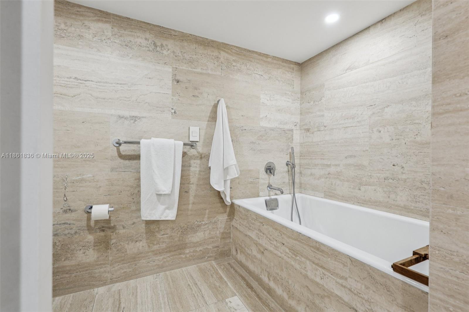 102 24th Street, Unit 1440 Miami Beach, FL 33139 - Photo 30 of 78 a bathroom with a bathtub and shower